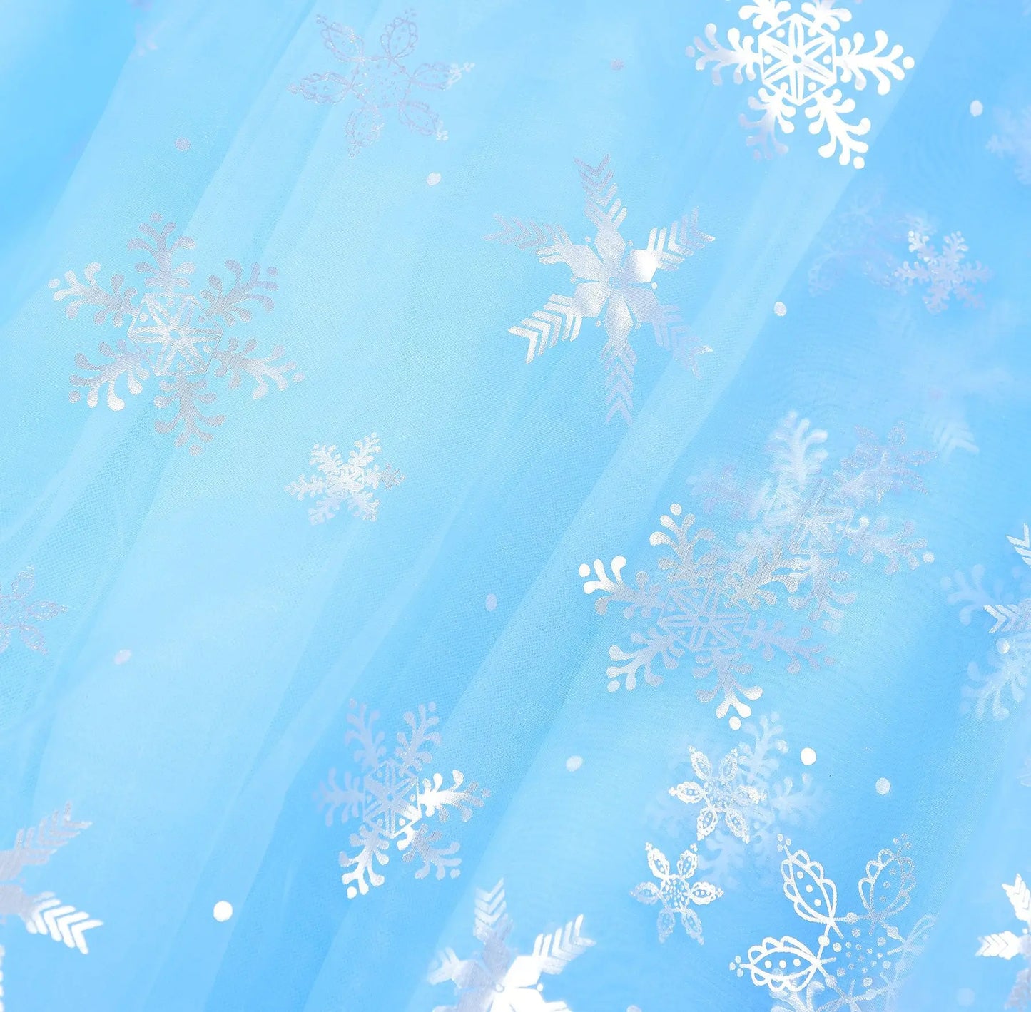 hemline detail of layered blue mesh skirt on princess dress