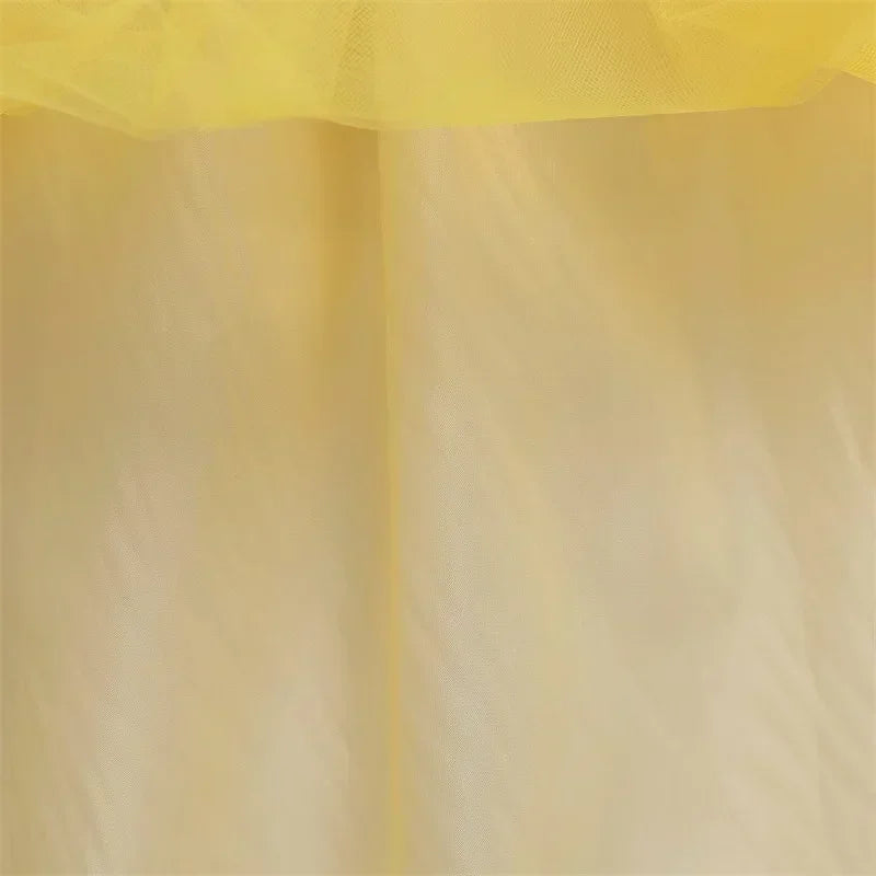 hemline detail of gold layered skirt with tulle effect